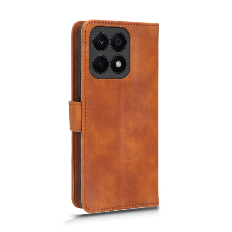 For Honor X8a Skin Feel Magnetic Flip Leather Phone Case(Brown) - Honor Cases by buy2fix | Online Shopping UK | buy2fix